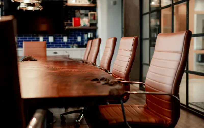 Walnut conference room with leather chairs